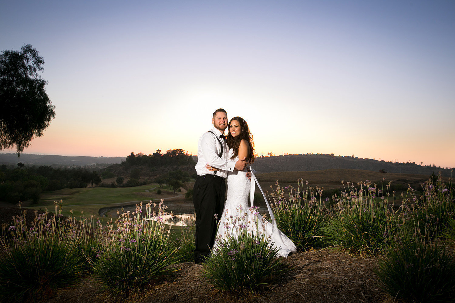 sunset open field with bride and groom