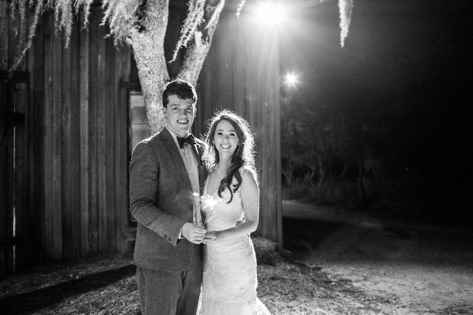 Bride and groom stand outside at night, Boone Hall Plantation, Charleston, South Carolina