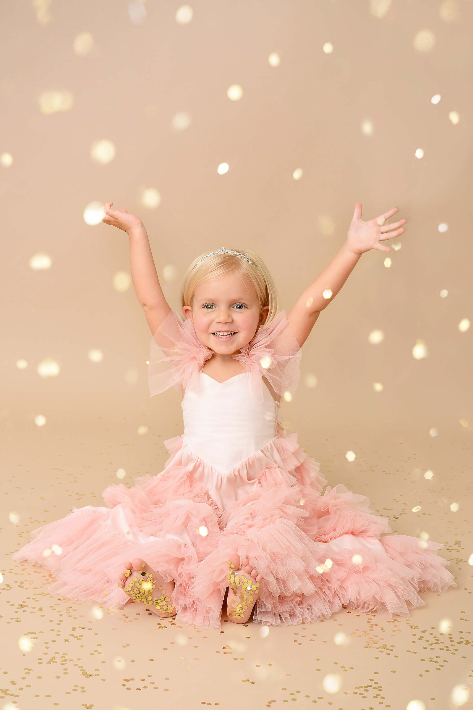 girl puts her hands in the air at a glitter photoshoot in houston