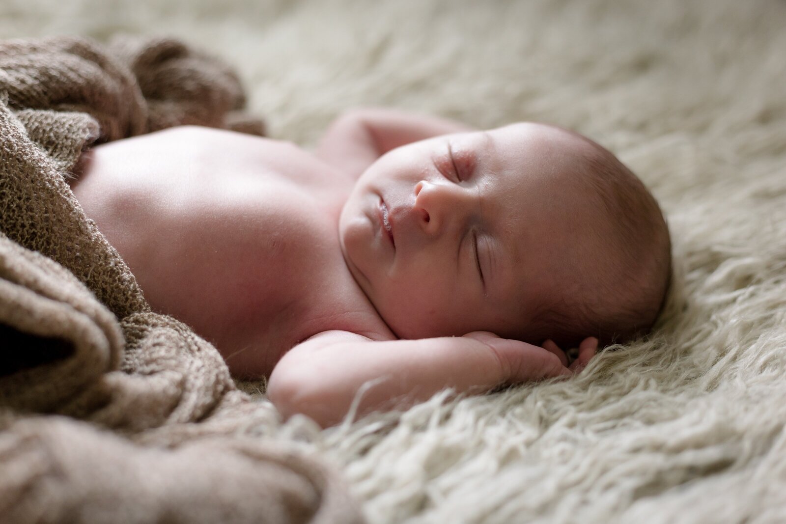Newborn sleeping during photo session