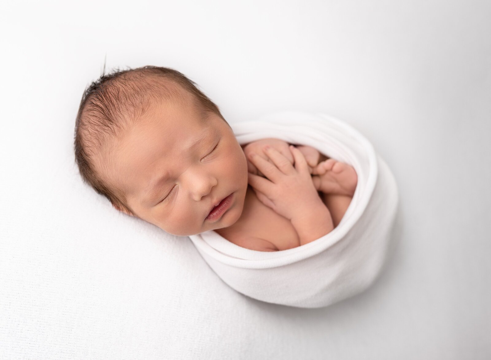 simple and modern photo of a baby on white