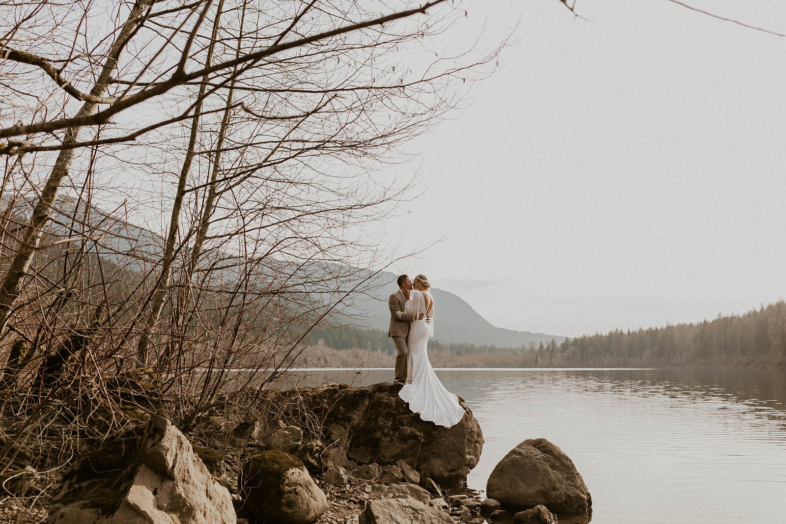 lakeside elopement romance with bride and groom