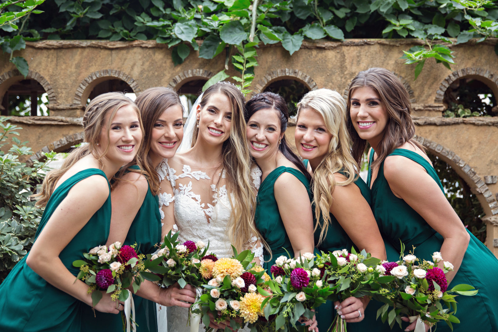 bride and bridesmaids in green dresses at Royal Botanical Gardens in Burlington