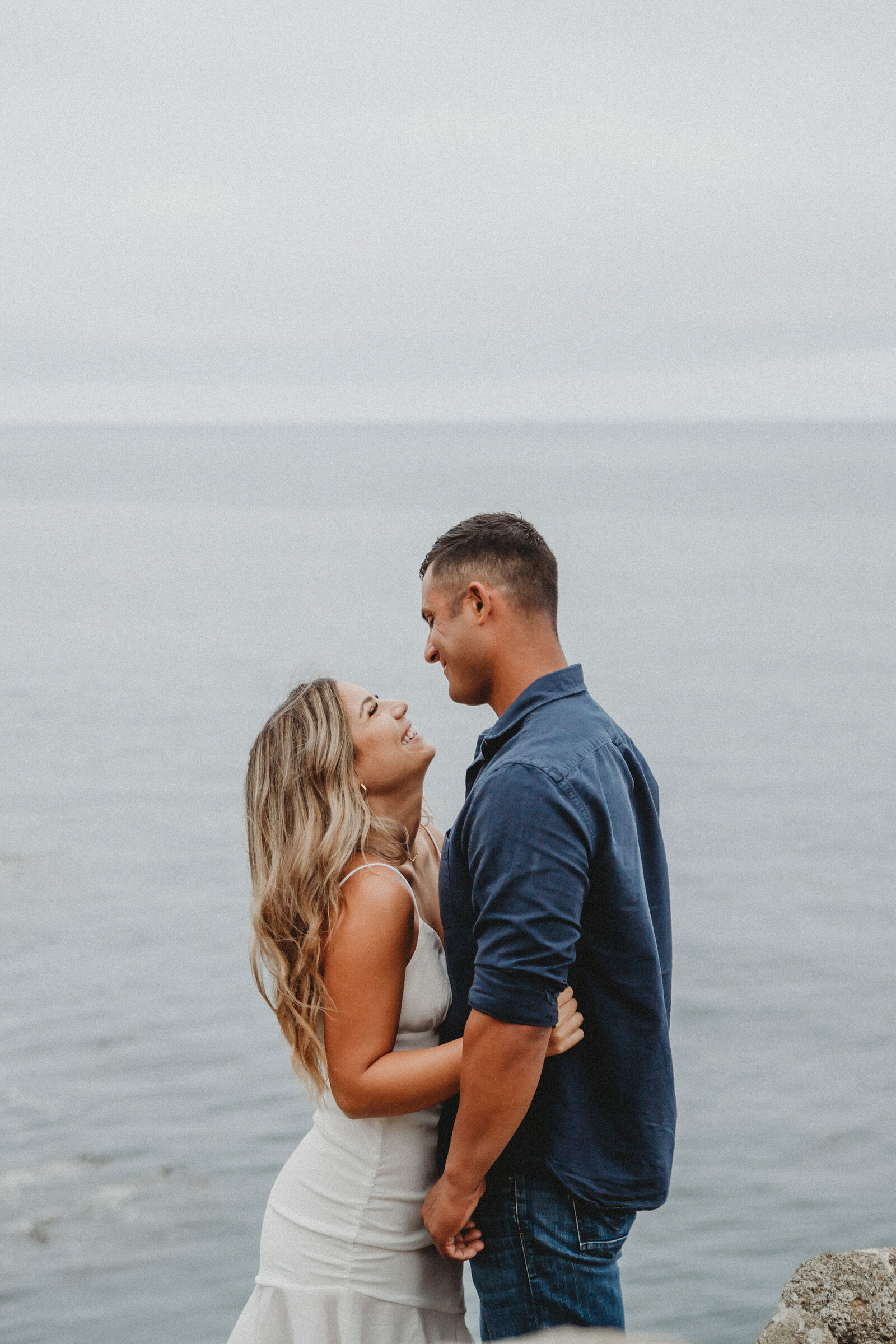 southern california beach engagement session couple hugging