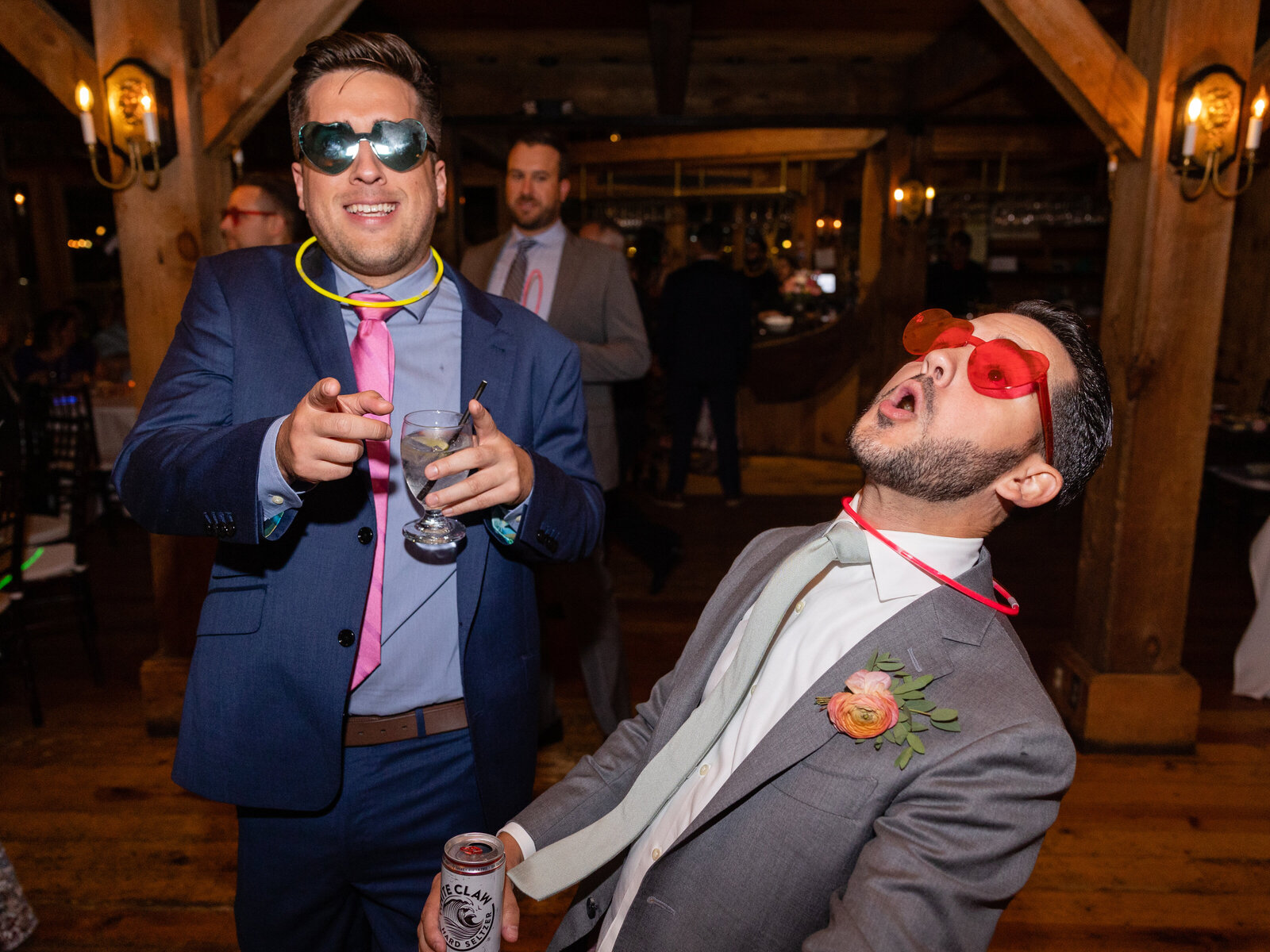guest with novelty glasses dancing at wedding