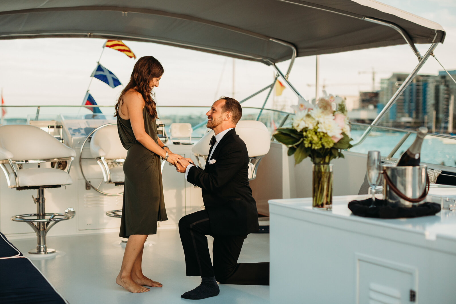 man proposes to woman on a yacht in boston harbor