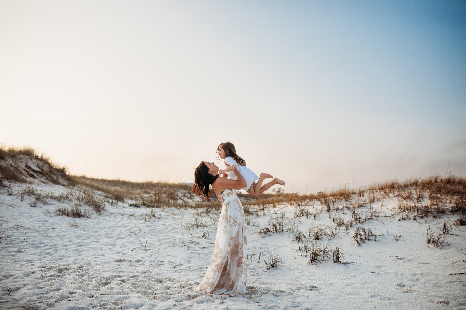 Pensacola Family Photography by Jennifer Beal Photography. Mother and daughter playing near sand dunes