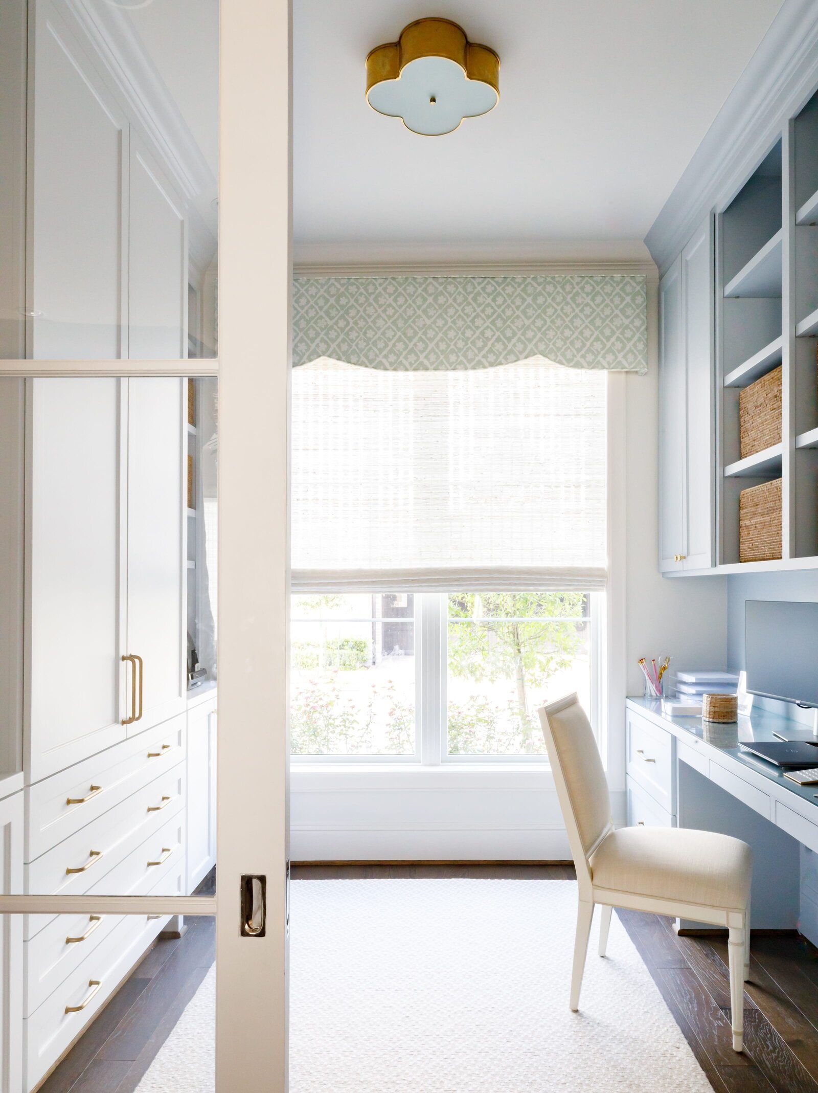 vision and hammer office with large window and blue accents