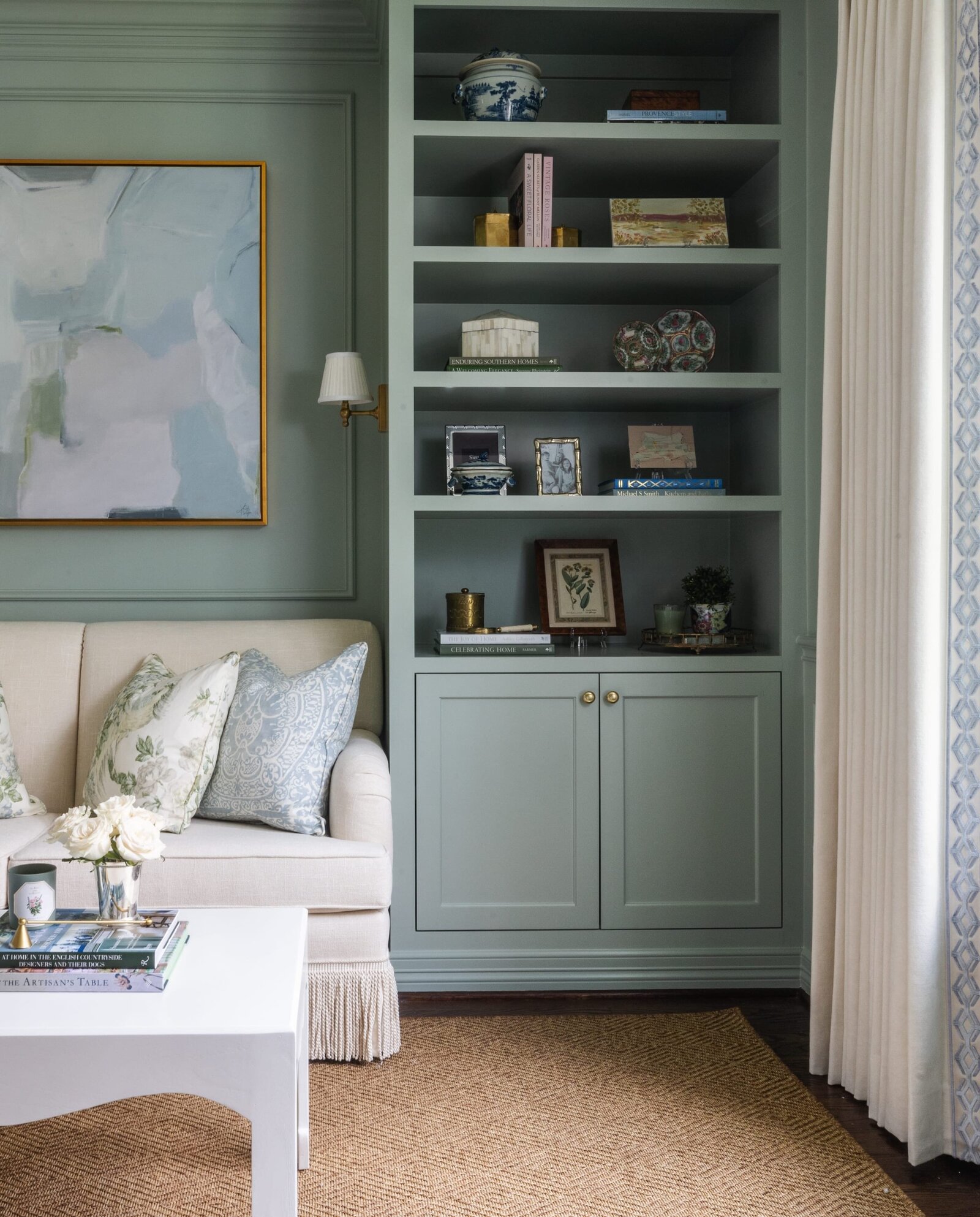 vision and hammer green buildins with styled shelves and picture frame