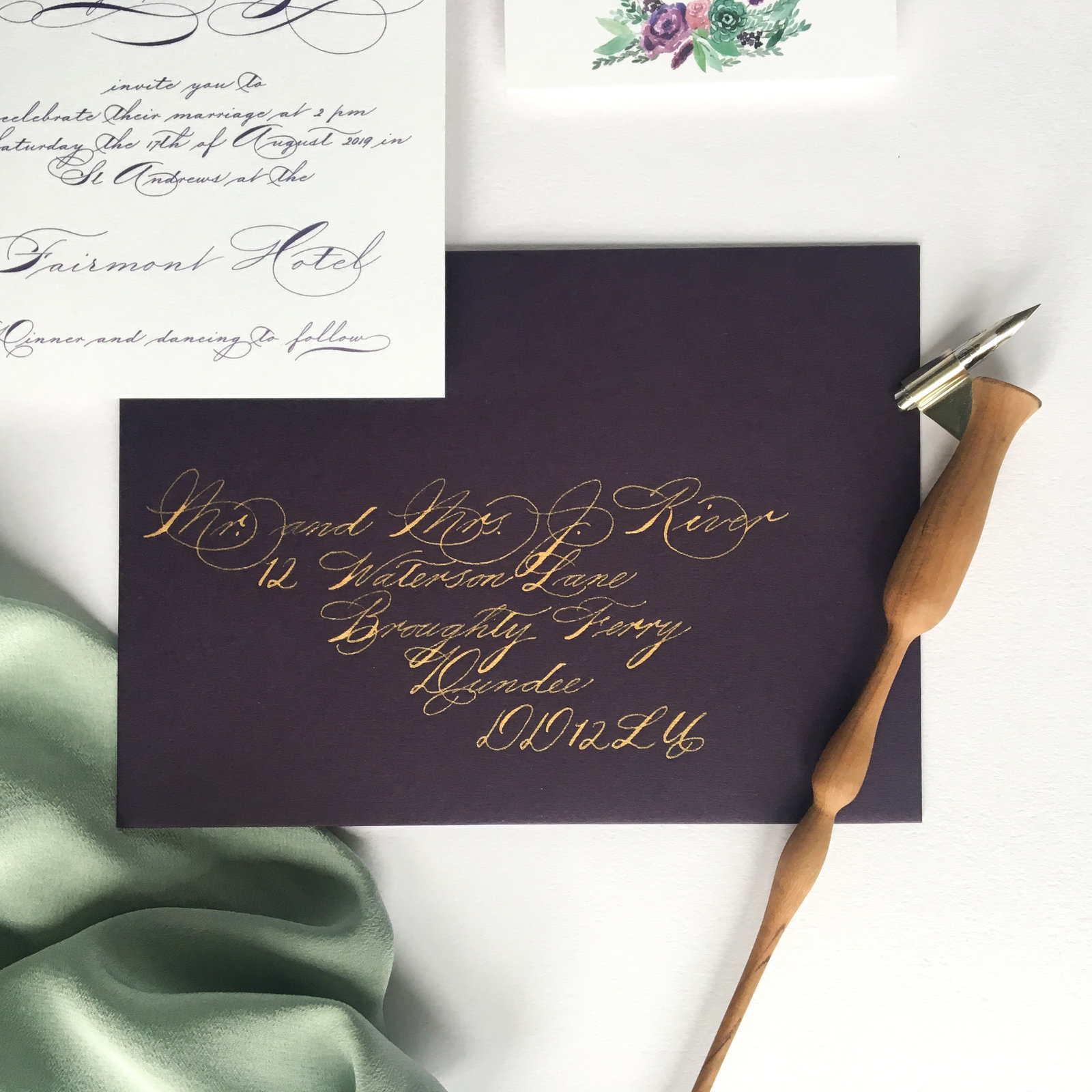Gold Spencerian calligraphy on Purple envelopes