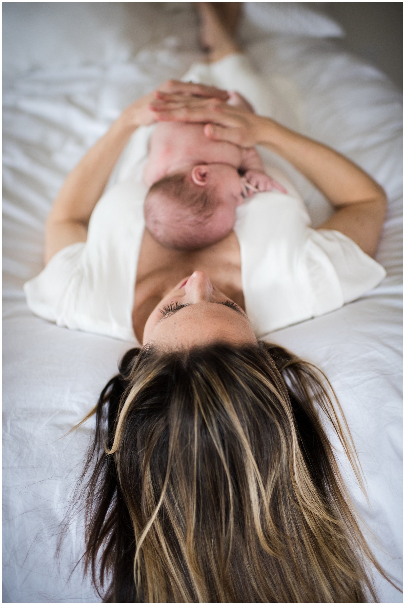 Newborn baby girl laying on moms chest newborn lifestyle photoshoot Emily Ann Photography Seattle Photographer