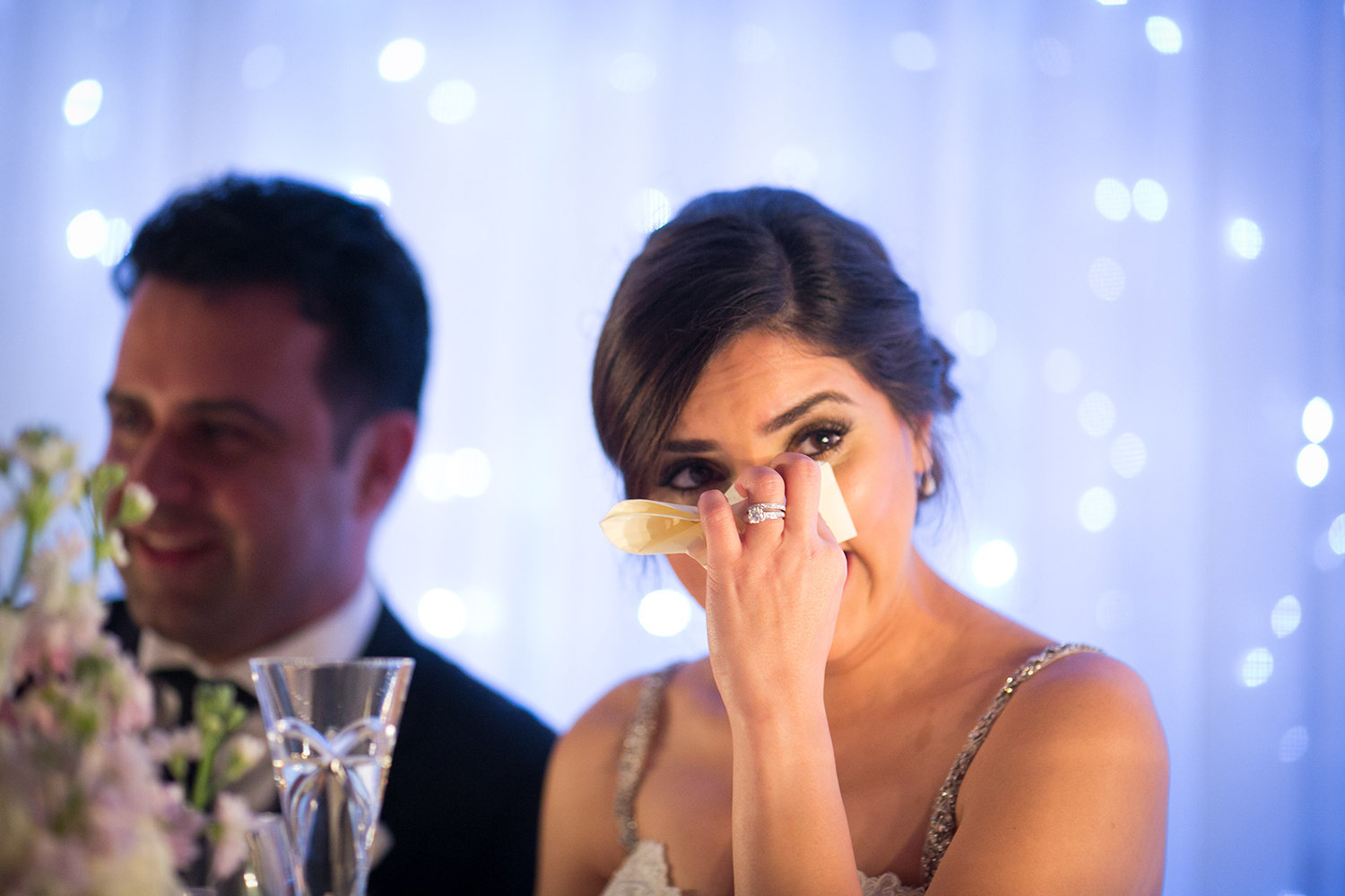 A bride tears up during her fathers speech