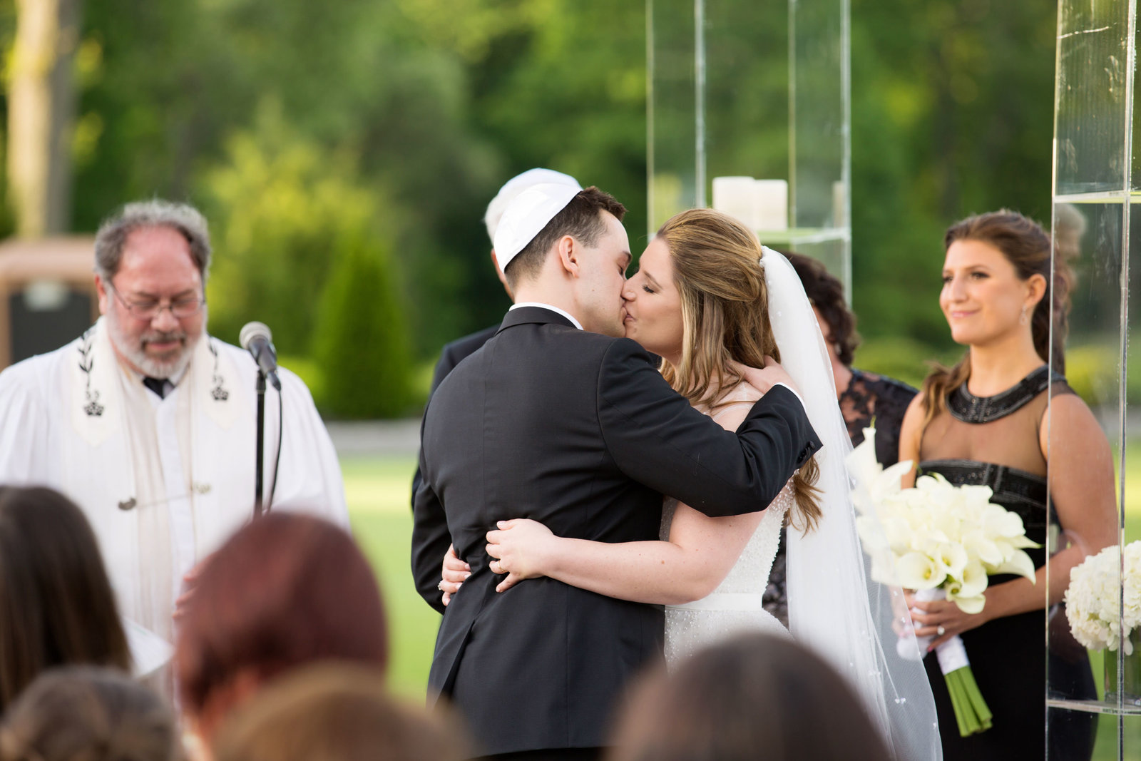 bride and groom kissing "I do" at Engineers Country Club