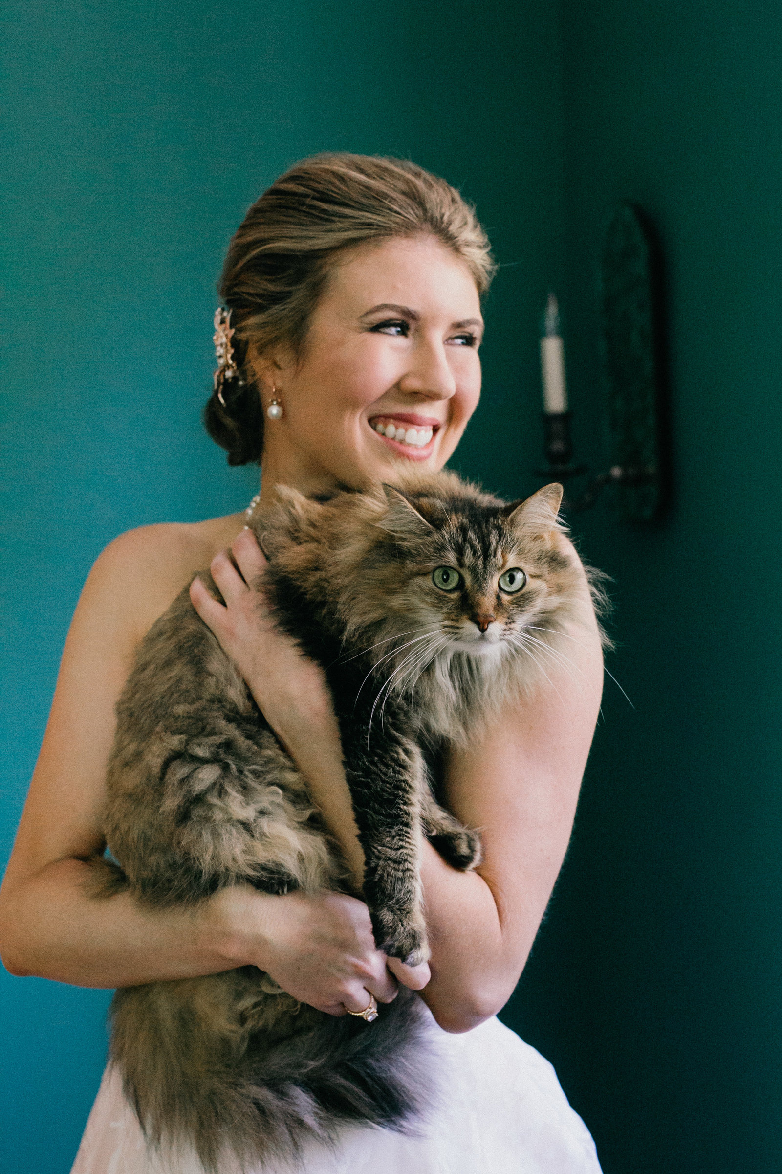 Bride photographed with her cat, before the wedding ceremony at Ellis Preserve.