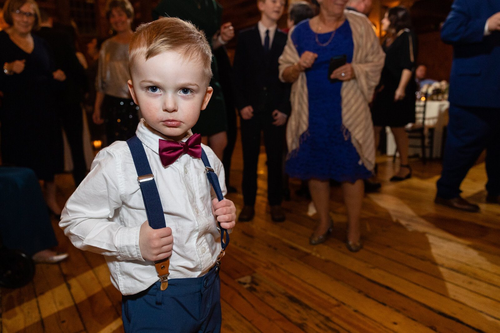 little boy makes face on dance floor