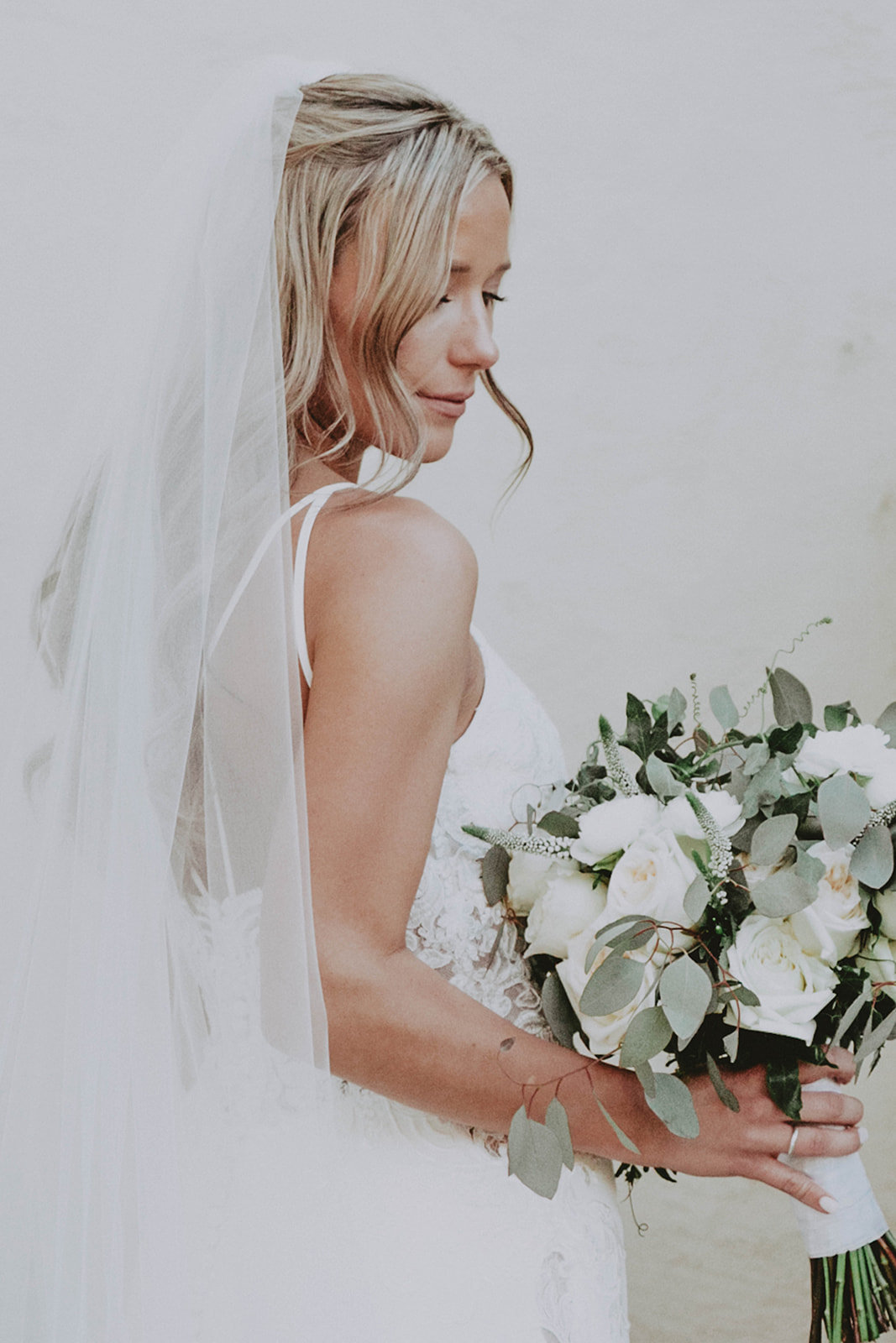 bride in veil with bouquet