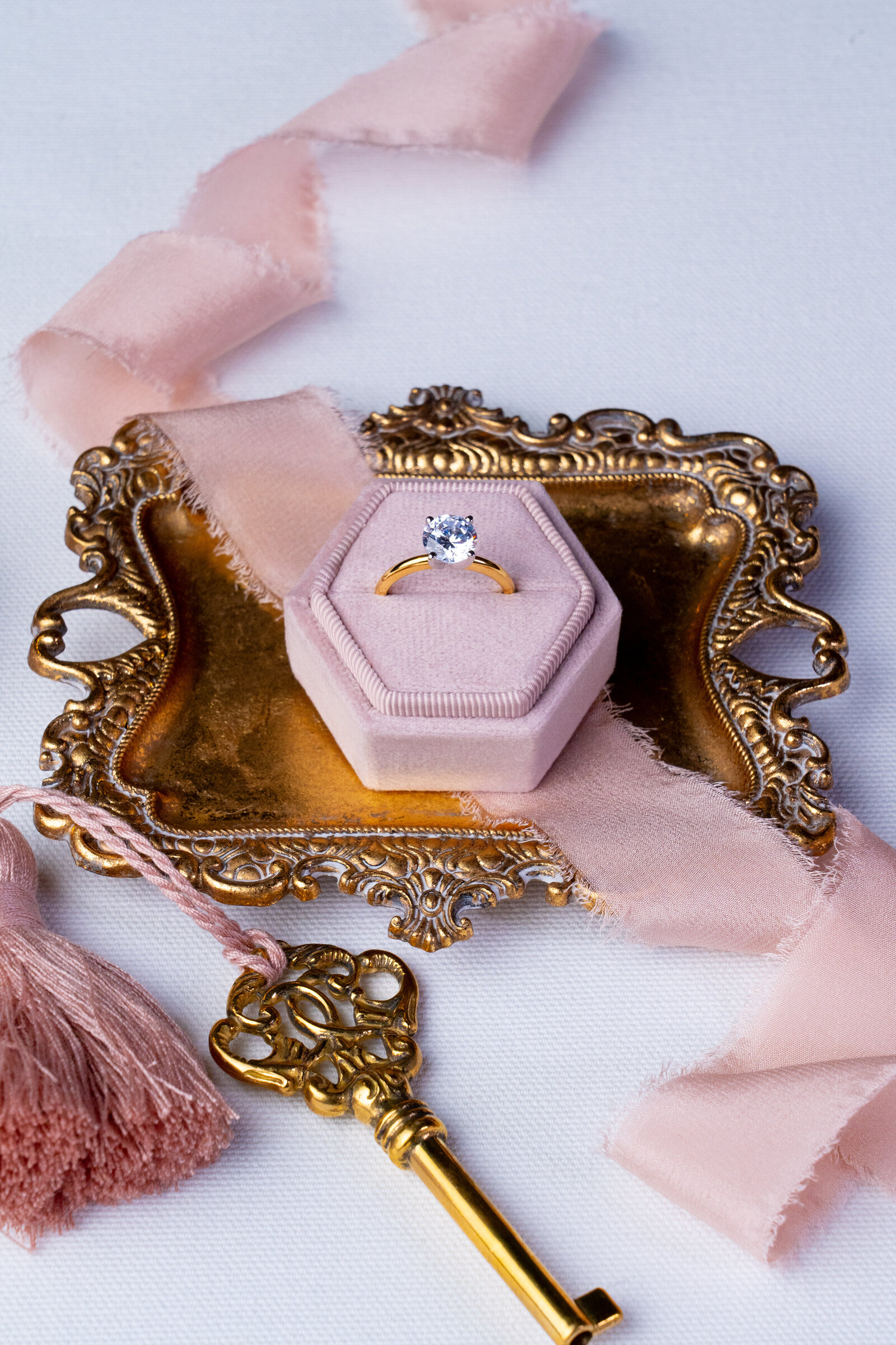 lovely gold solitaire ring in pink velour box