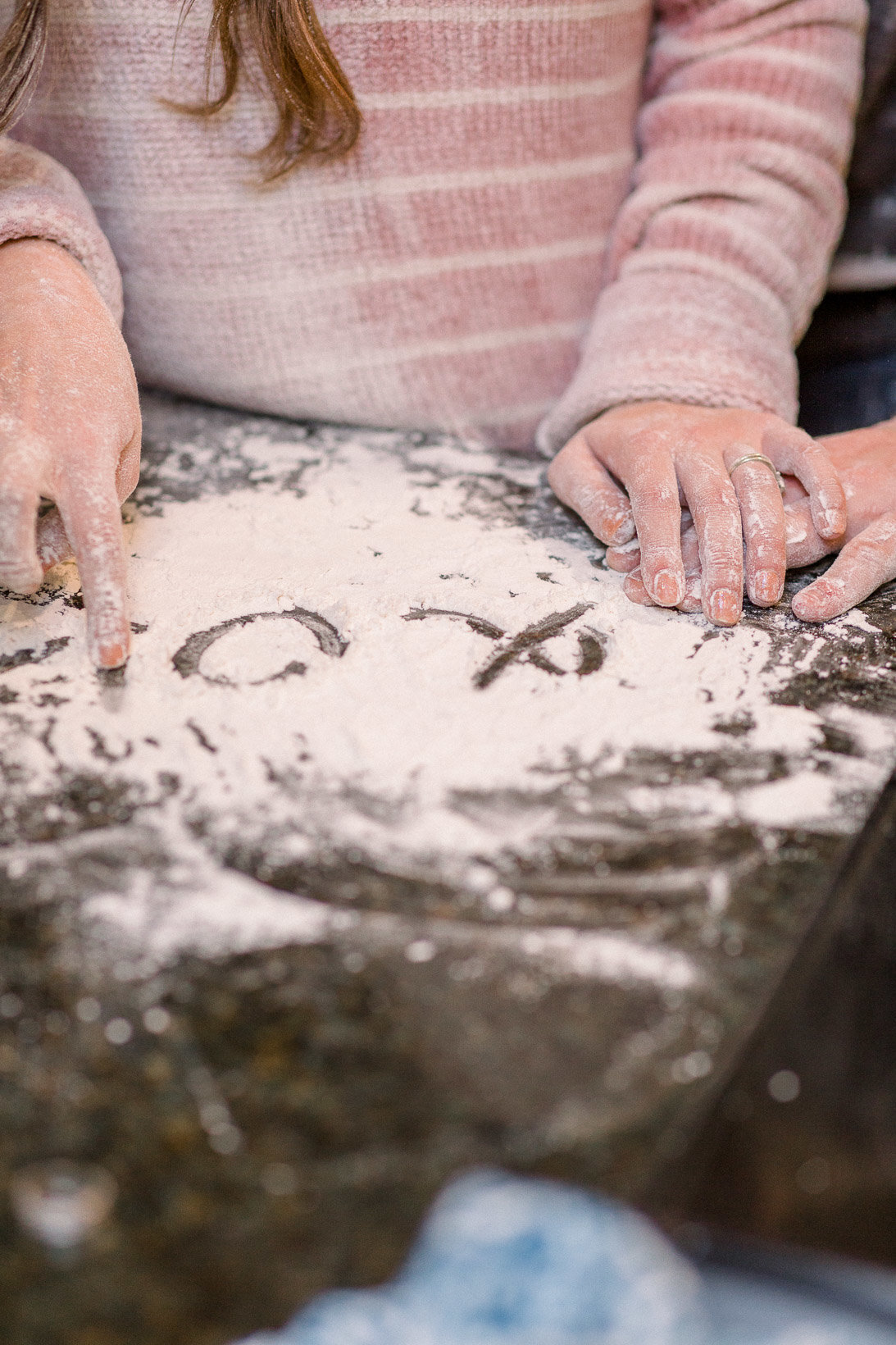 Writing cute notes in the flour captured by Staci Addison Photography