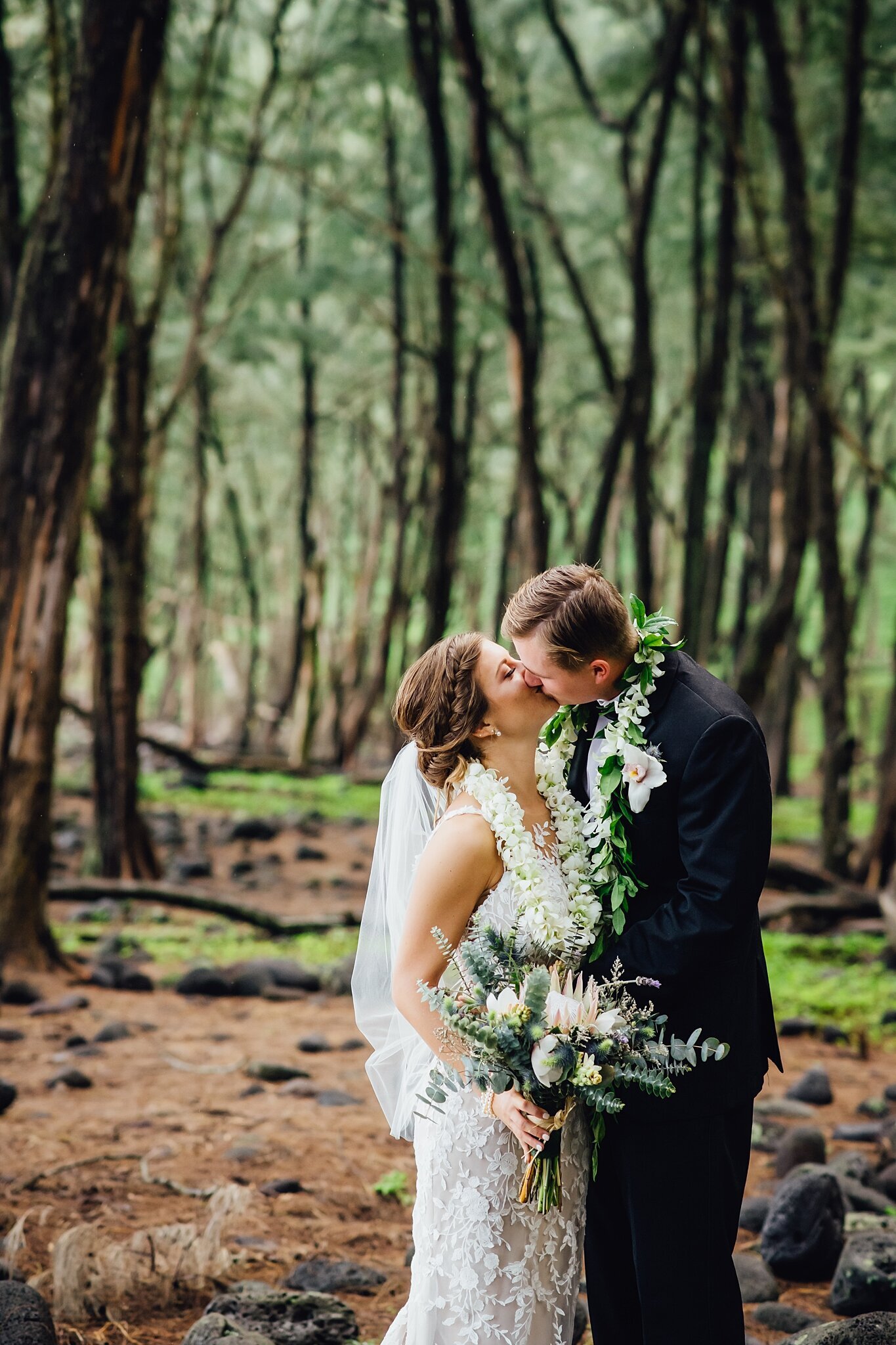couples kiss in forest