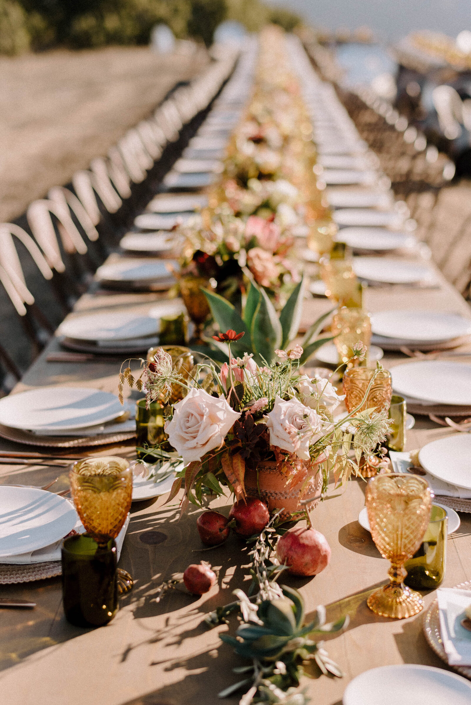 Long Farm Tables with Flowers for a wedding dinner at Albatross Ridge