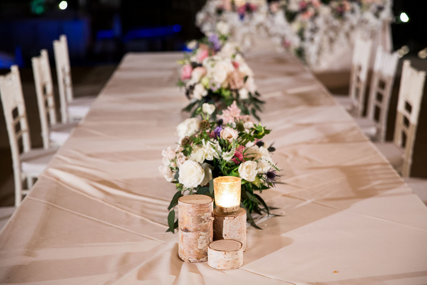 Floral centerpieces at a wedding reception in Del Mar