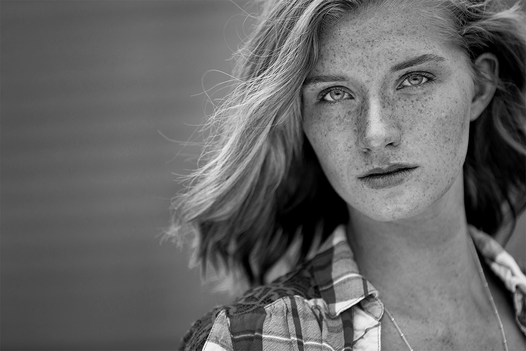 Senior Pictures Near Me. Black and White picture of senior girl in the country. Billings, Montana. Freckles on Face. Beautiful Images.