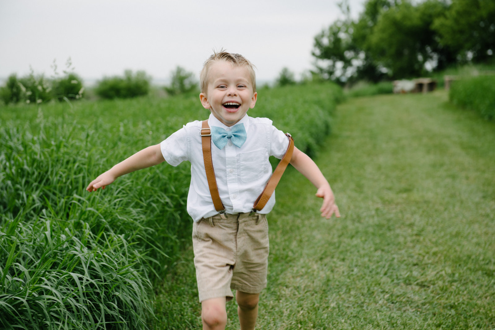 ring bearer running and laughing