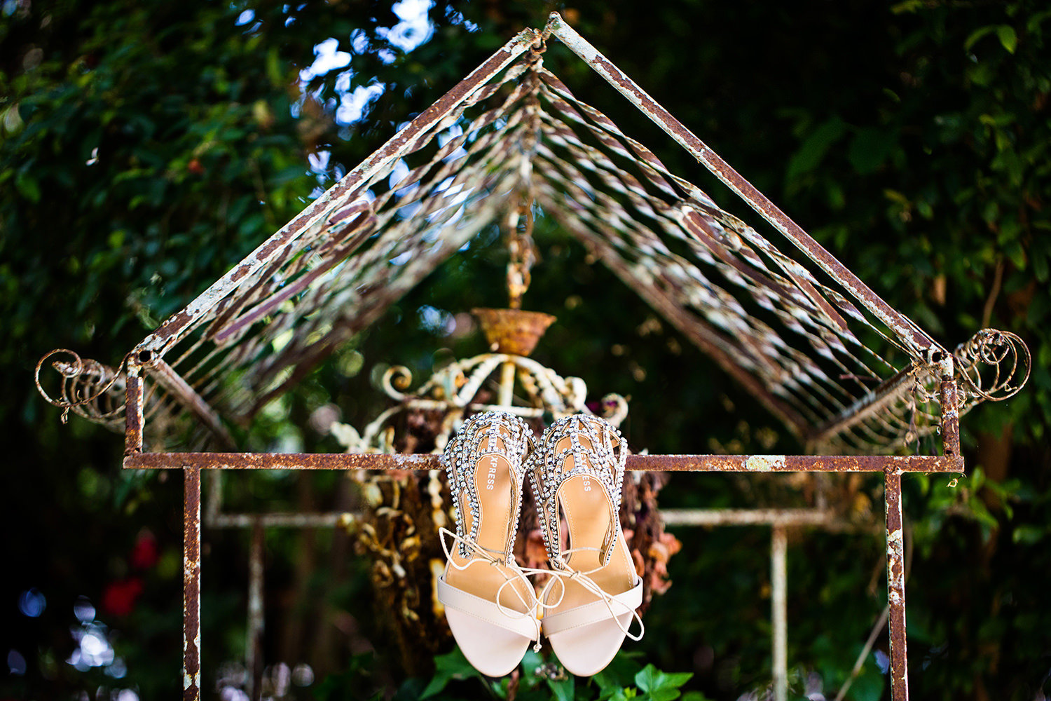 Creative wedding shoe detail shot in a garden setting