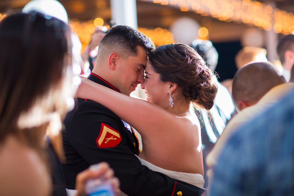 military wedding photo of a couple dancing, candid image