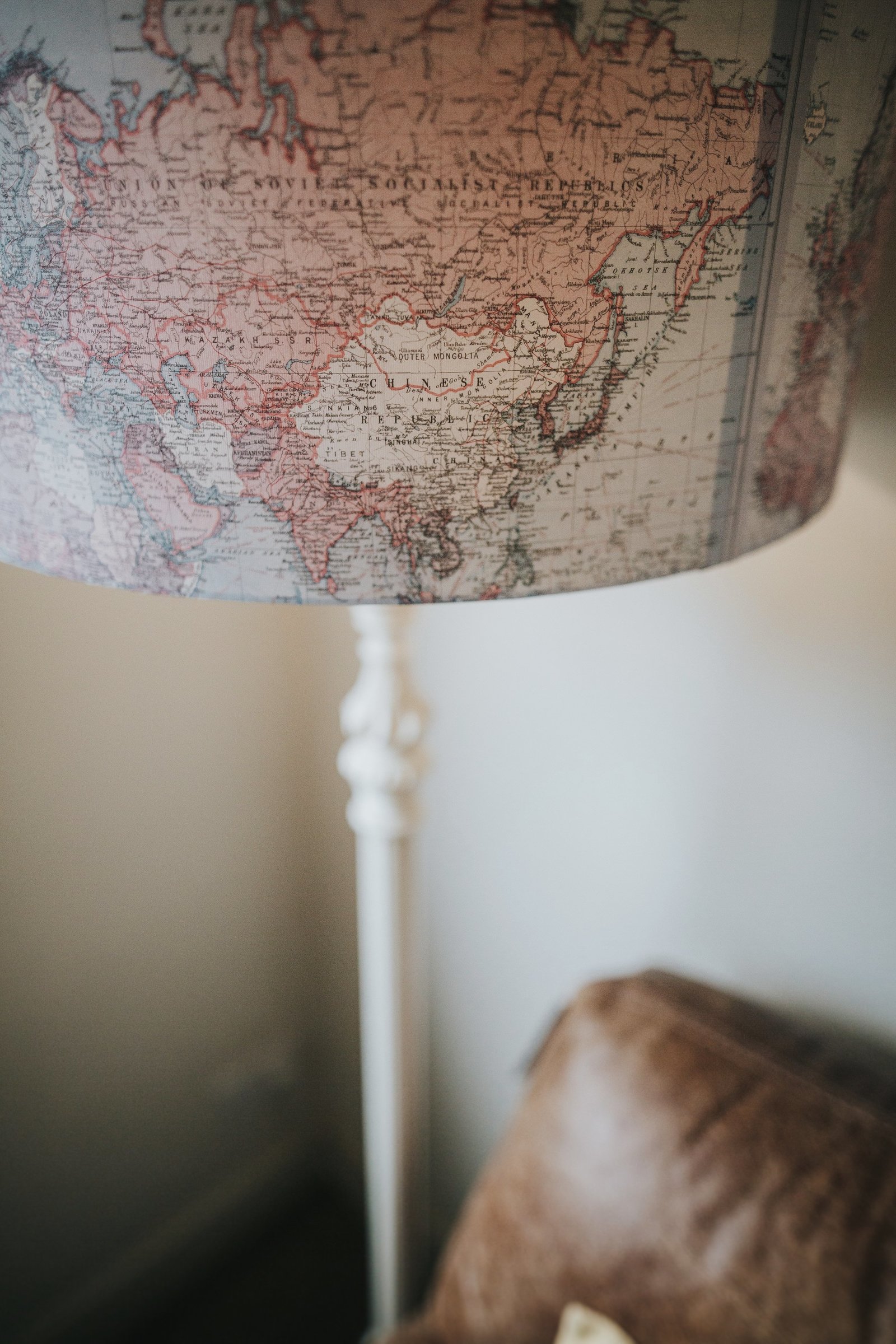 Map of the world lampshade in the lounge at Baldry's Lake District Cottage