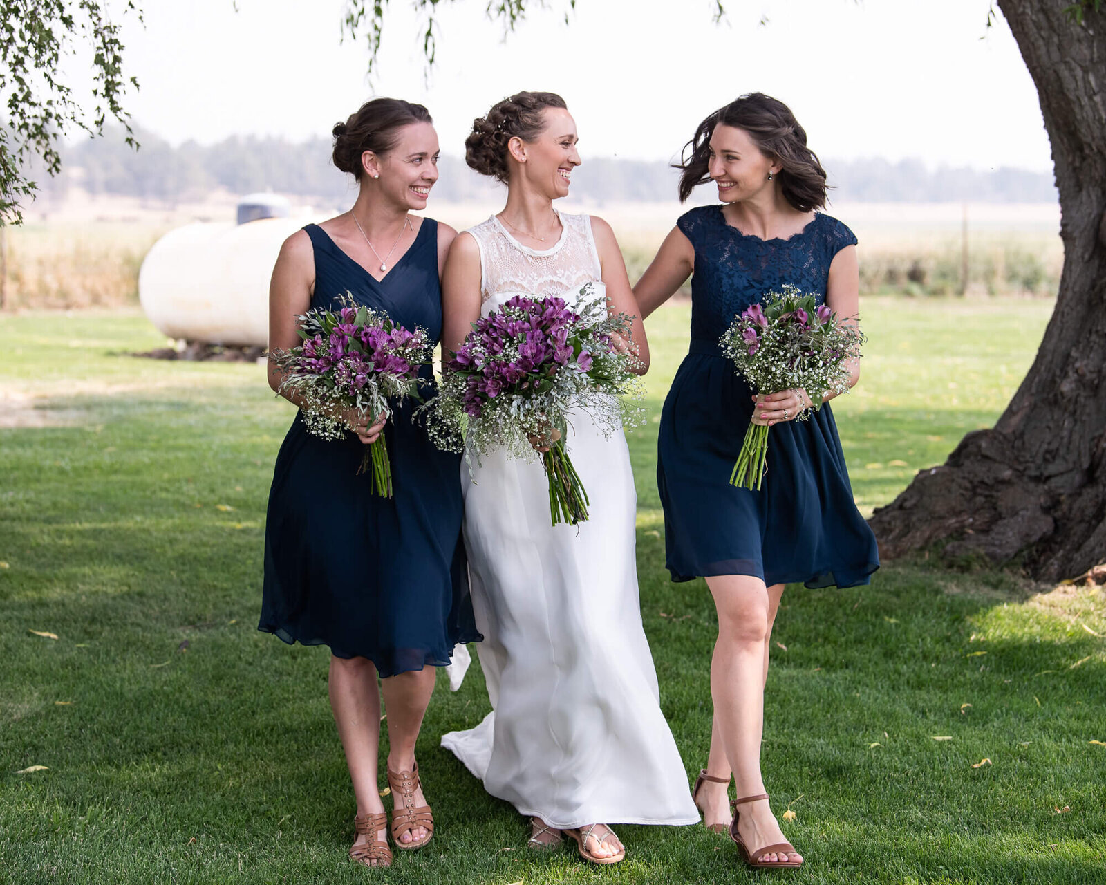 Bride and Bridesmaids  walking and laughing together