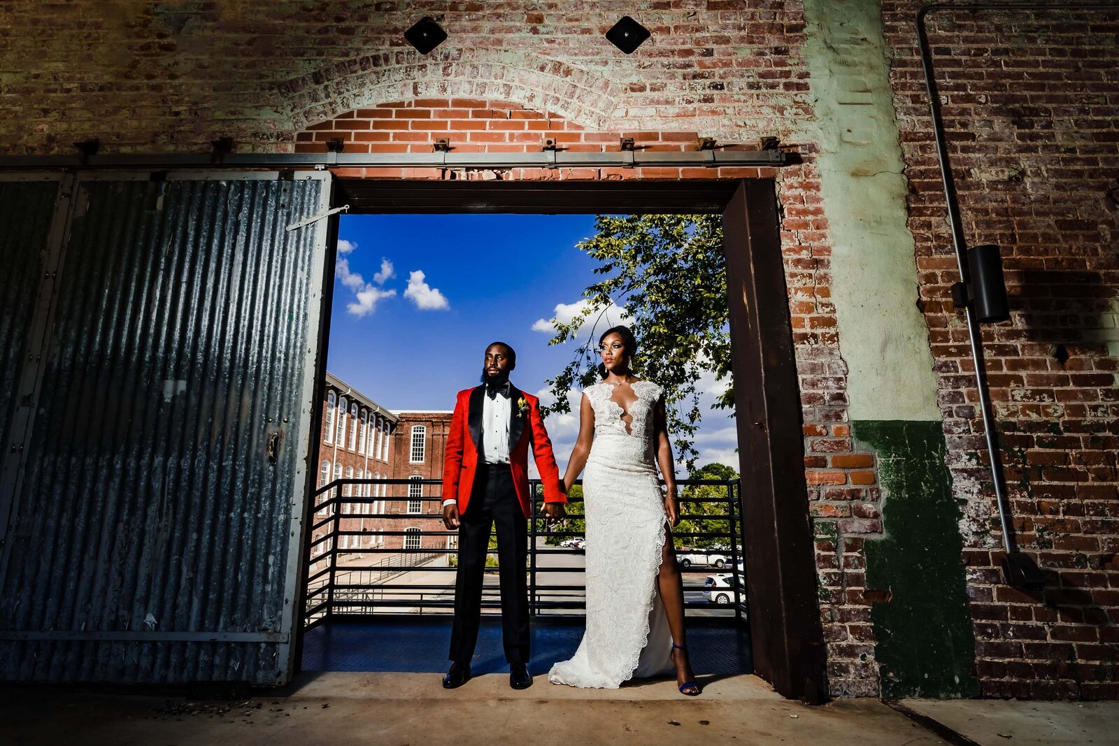 black couple in wedding attire poses for creative wedding photography