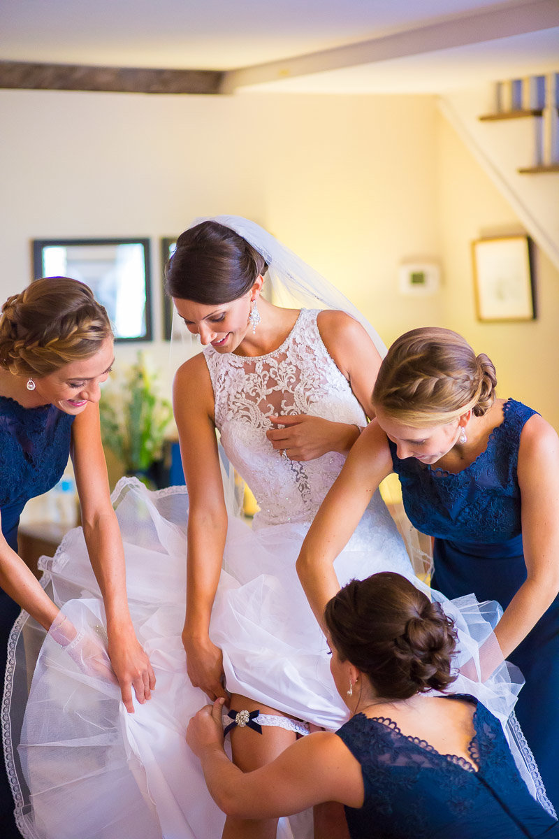 A photo of a bride getting ready for a usna naval academy chapel wedding