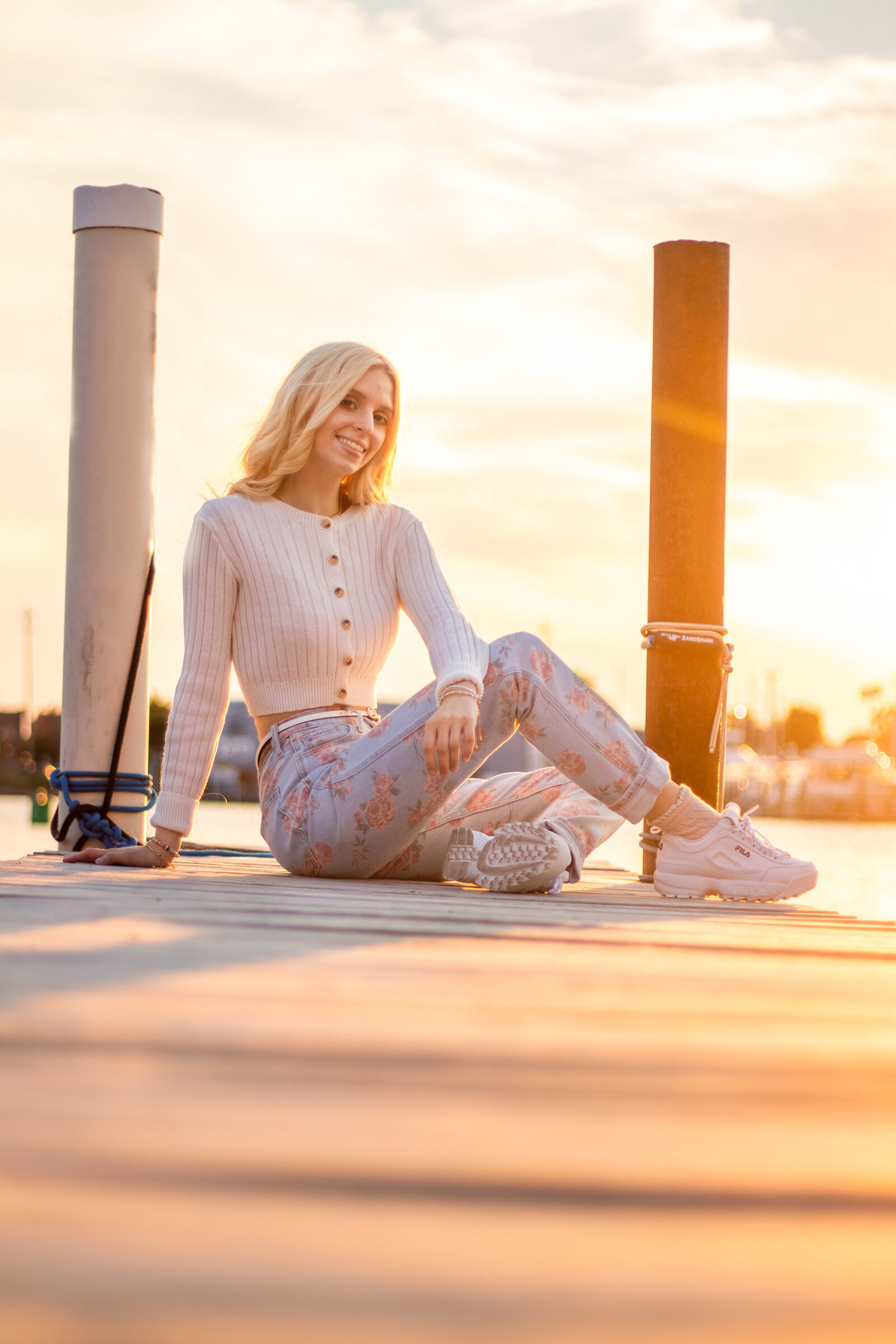 Downtown Bay City senior photos at sunset on boat dock
