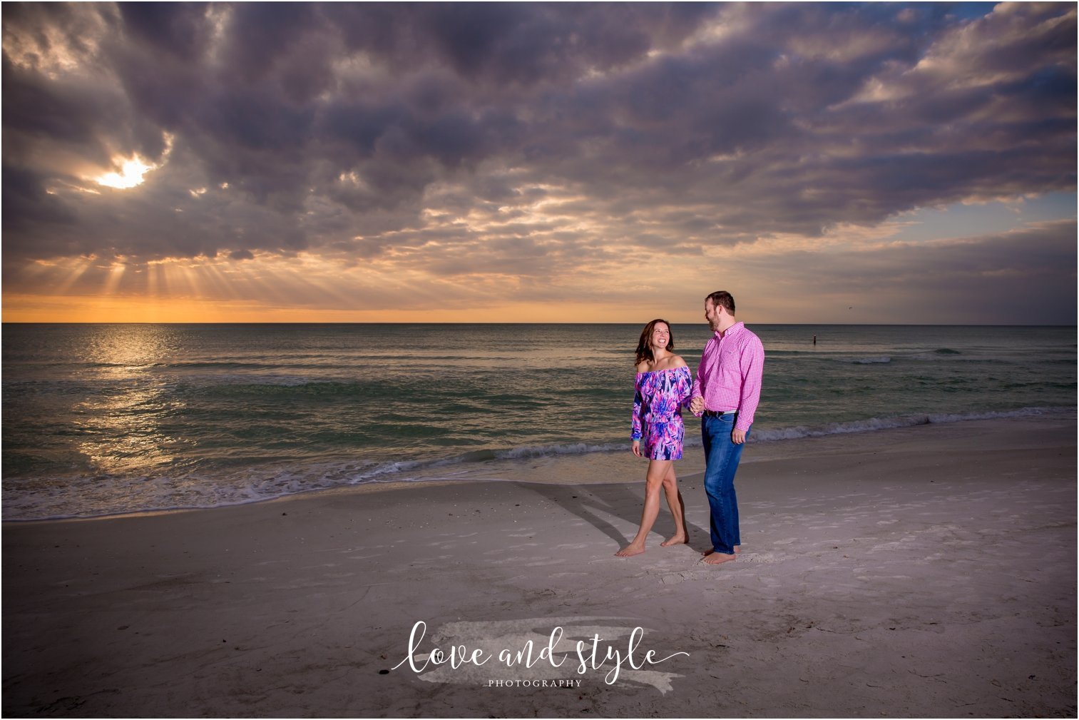 Anna Maria Island Engagement Photography of couple holding hands and walking along the beach