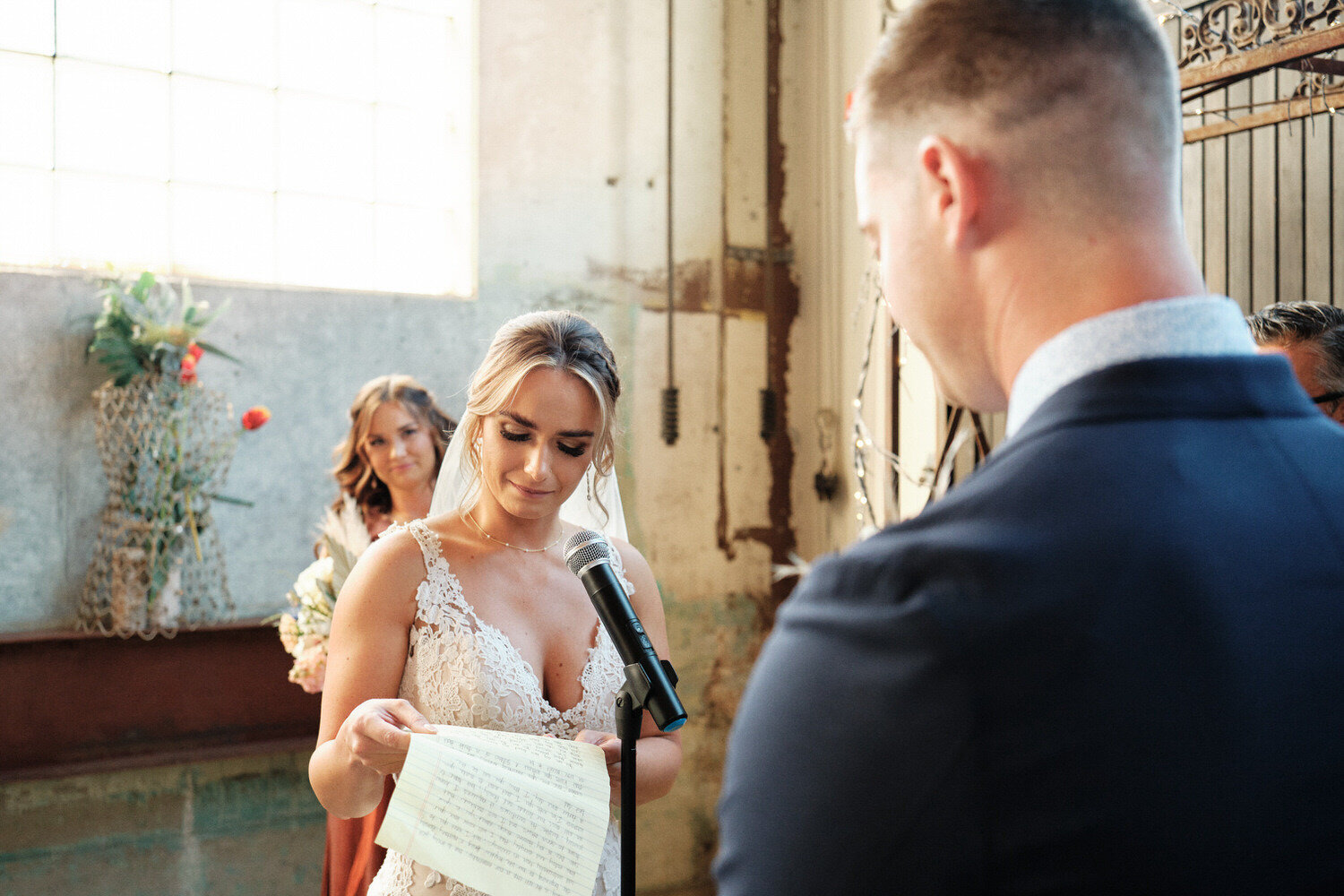 An emotional bride reads her wedding vows