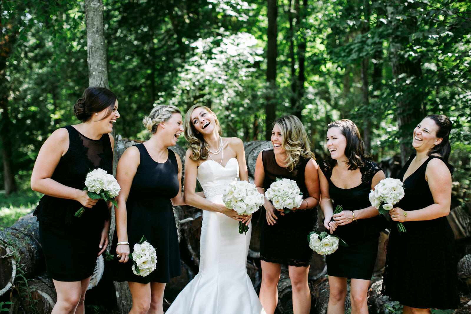 bridesmaids laughing black dresses