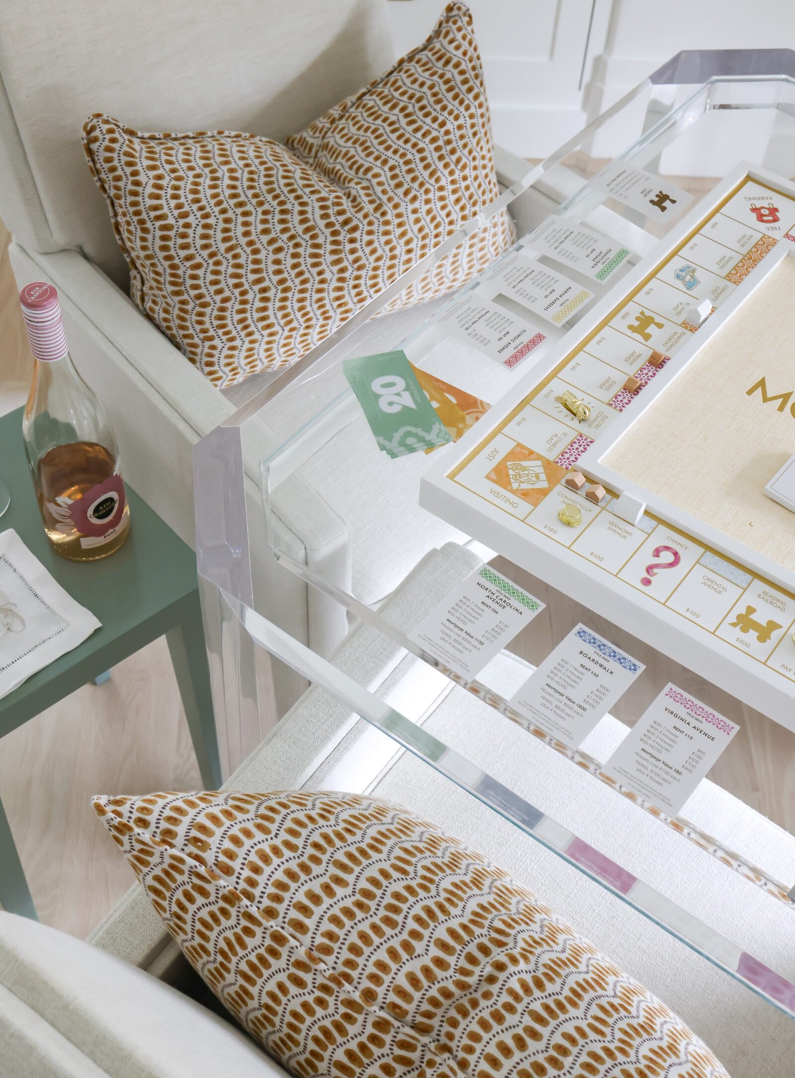 vision and hammer white chair and game table with accent pillows