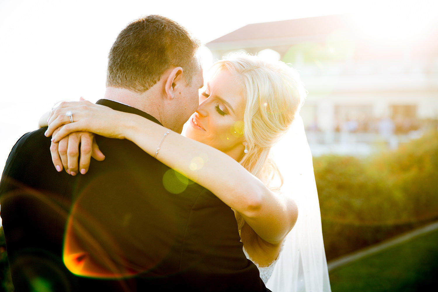 bride and groom with lens flare
