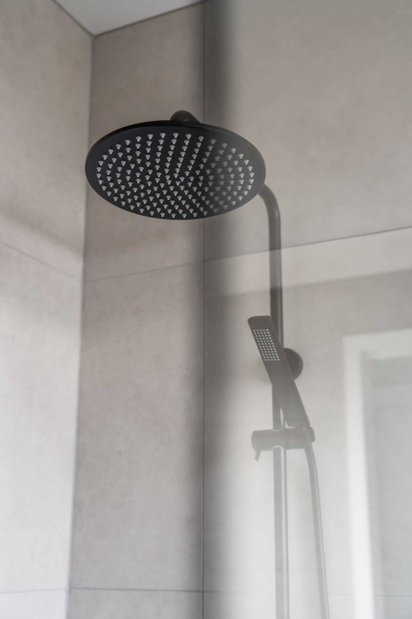 Completed bathroom tiling and fixtures by AR Construction in Warrnambool