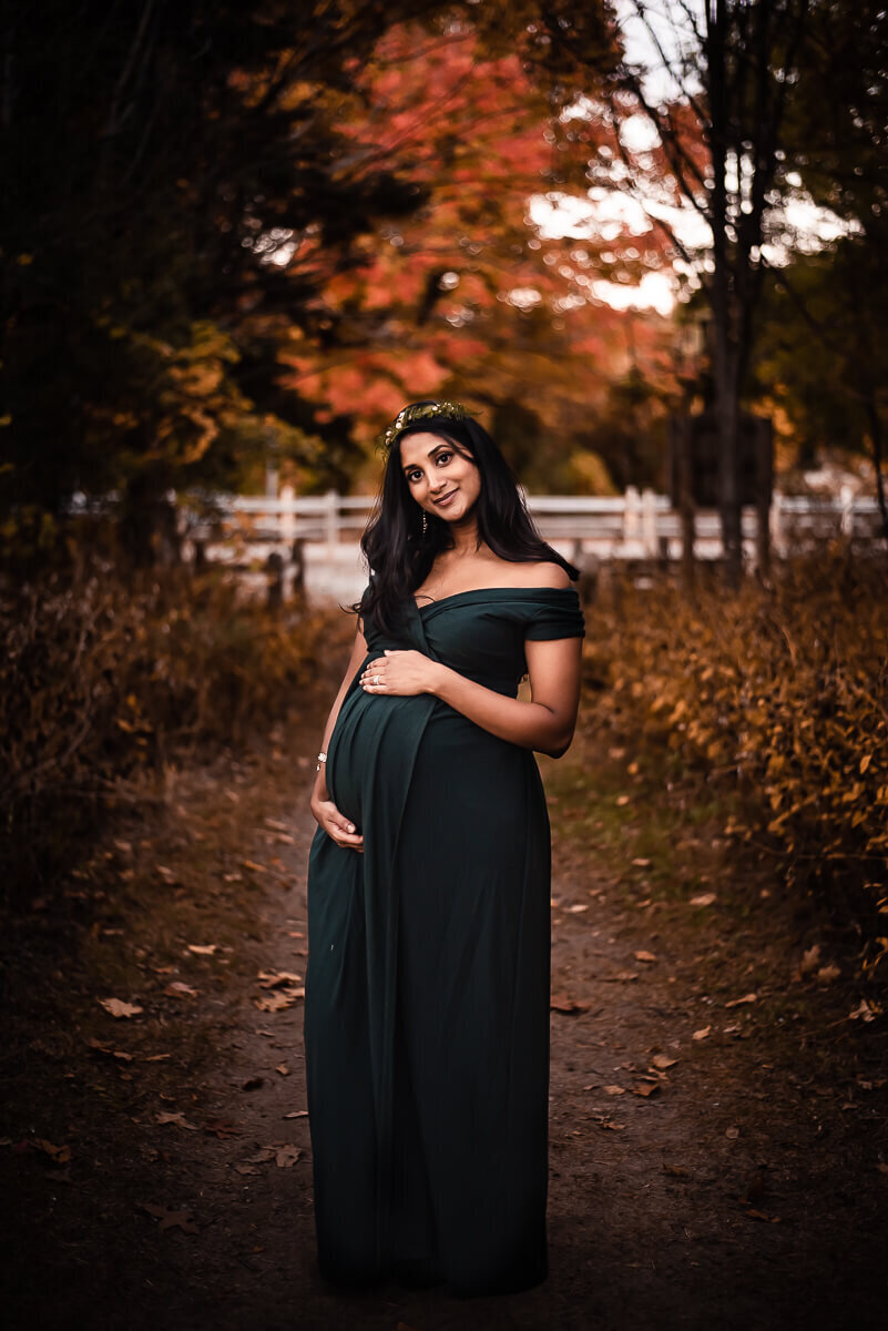 Beautiful expecting mom in Toronto maternity photographer's green gown