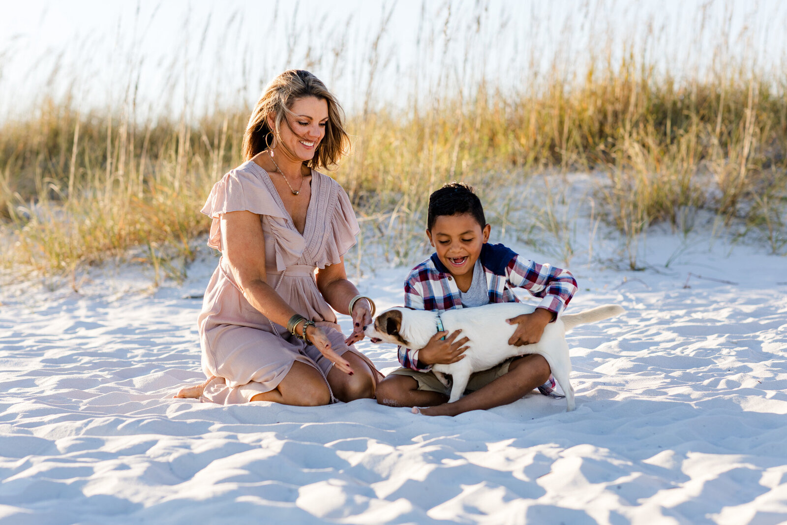 Pensacola Beach Dog Beach Photography. Mother and son holding dog.