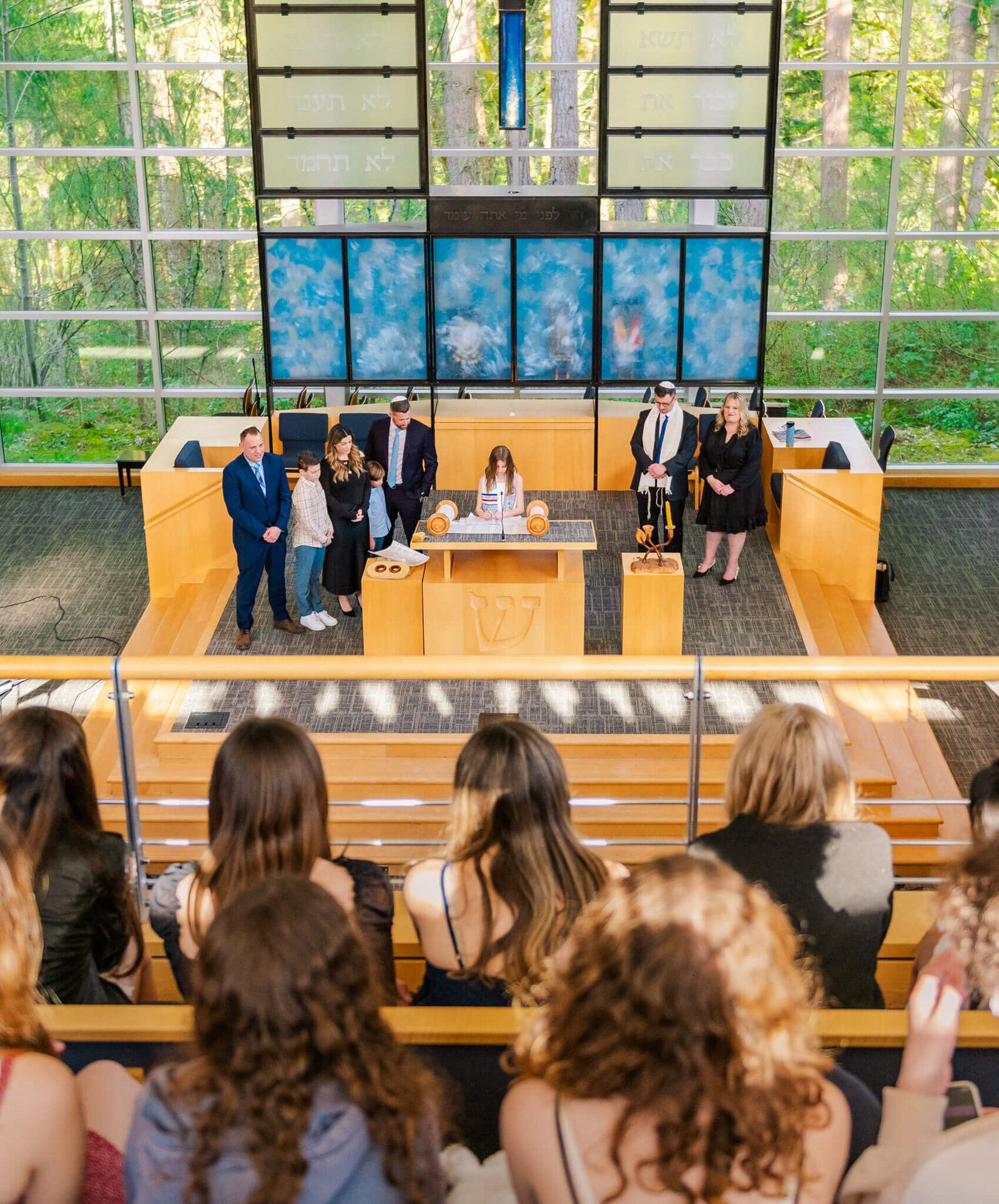 A Bellevue Bar and Bat Mitzvah Photography view from the balcony of a teen girl performing her haftarah at the Bimah