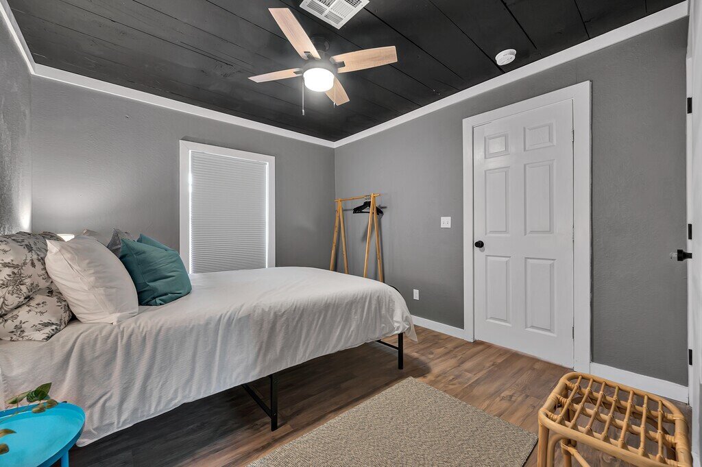 Bedroom with Queen size bed in this two-bedroom, one-bathroom vacation rental house for five located just 5 minutes from Magnolia, Baylor, and all things downtown Waco.