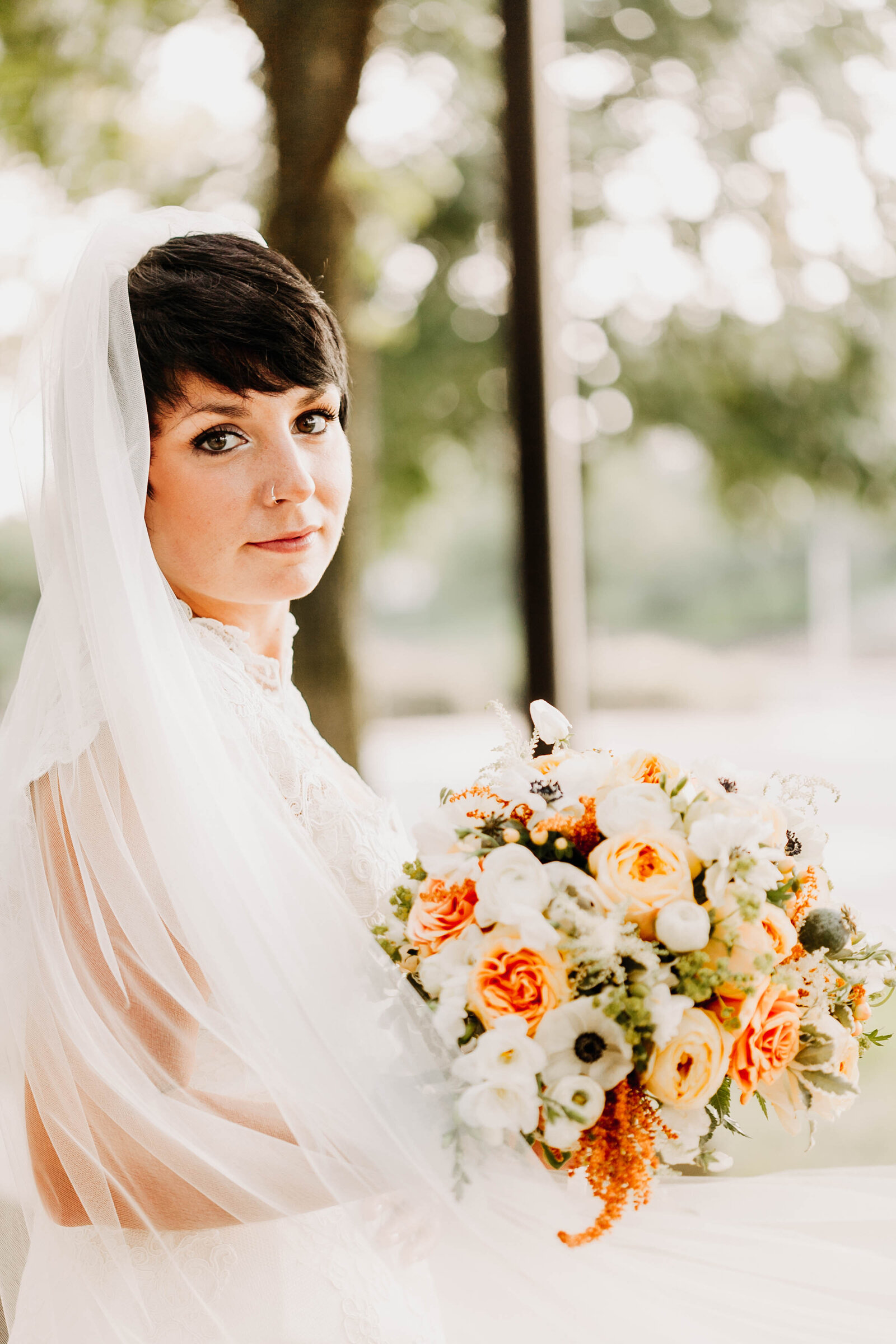 bride long veil orange flower bouquet