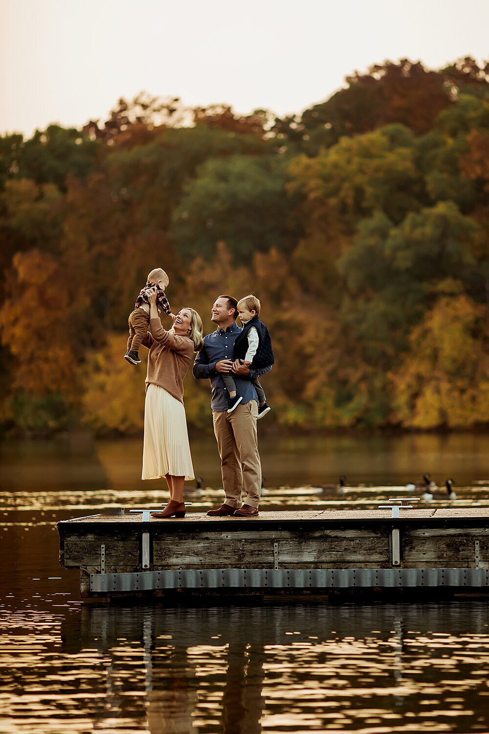 Family Photographer, family standing on a dock