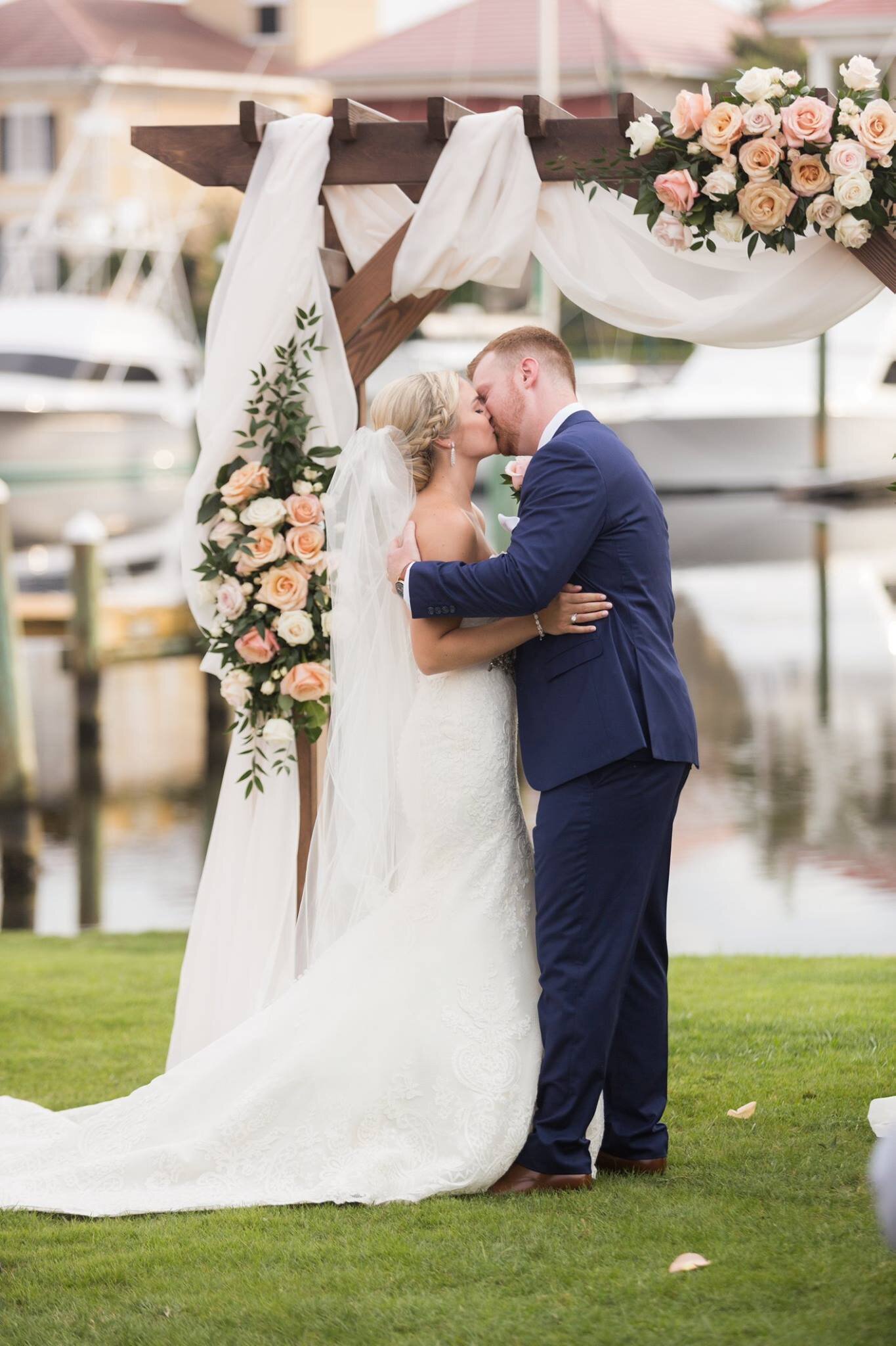 Venue Couple First Kiss at Pensacola at Venue Palafox Wharf Waterfront Wedding Venue