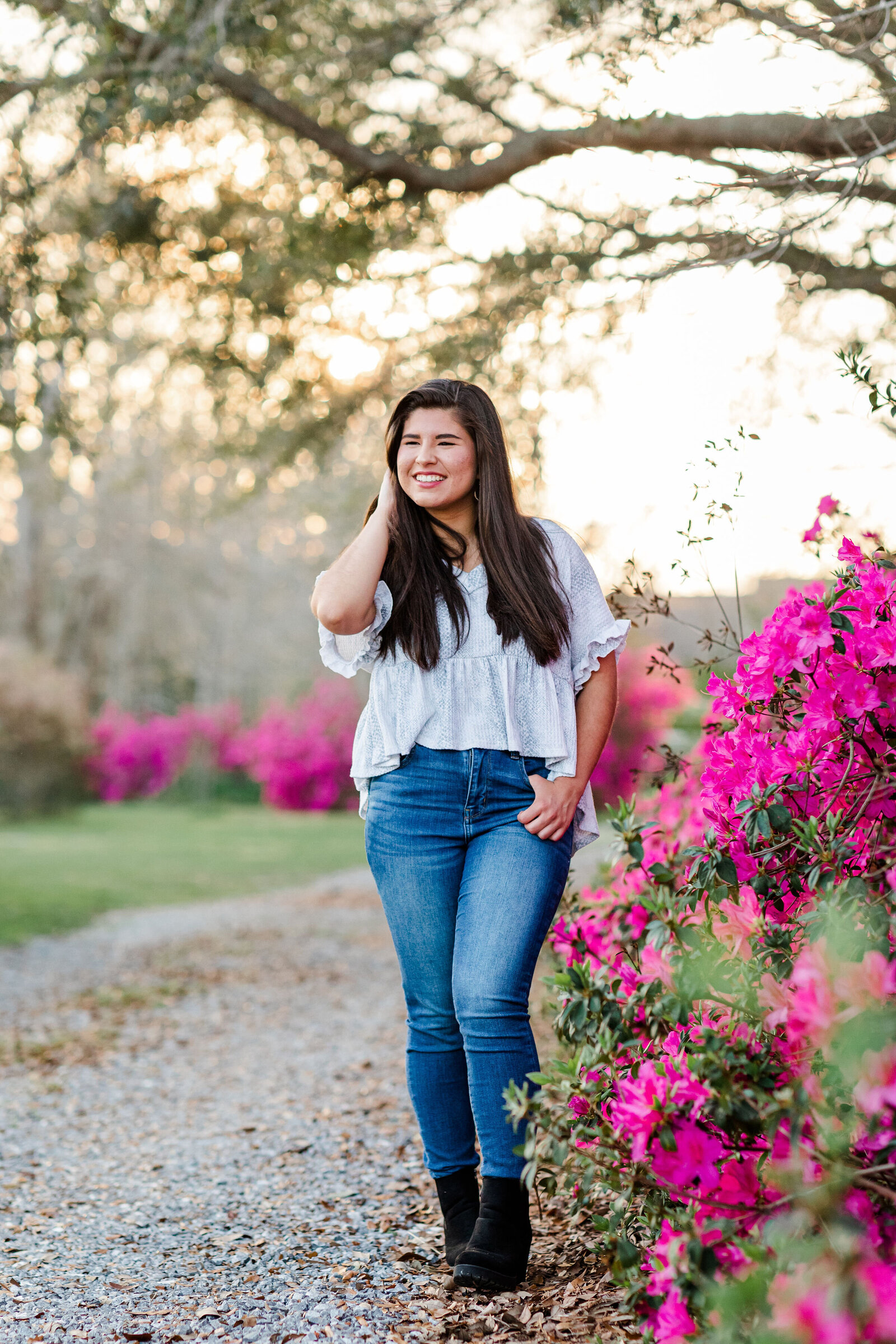 Senior girl photos posing near azaleas with Jennifer Beal Photography