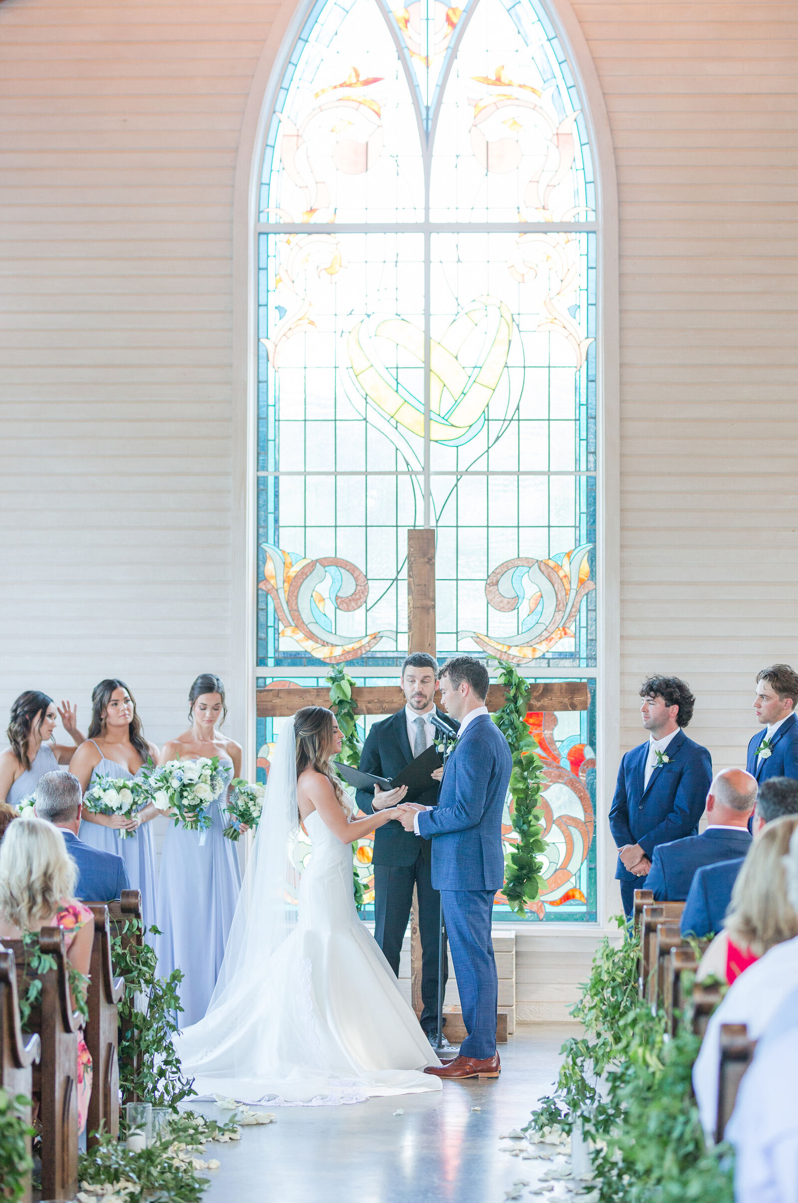 wedding ceremony in stained glass church