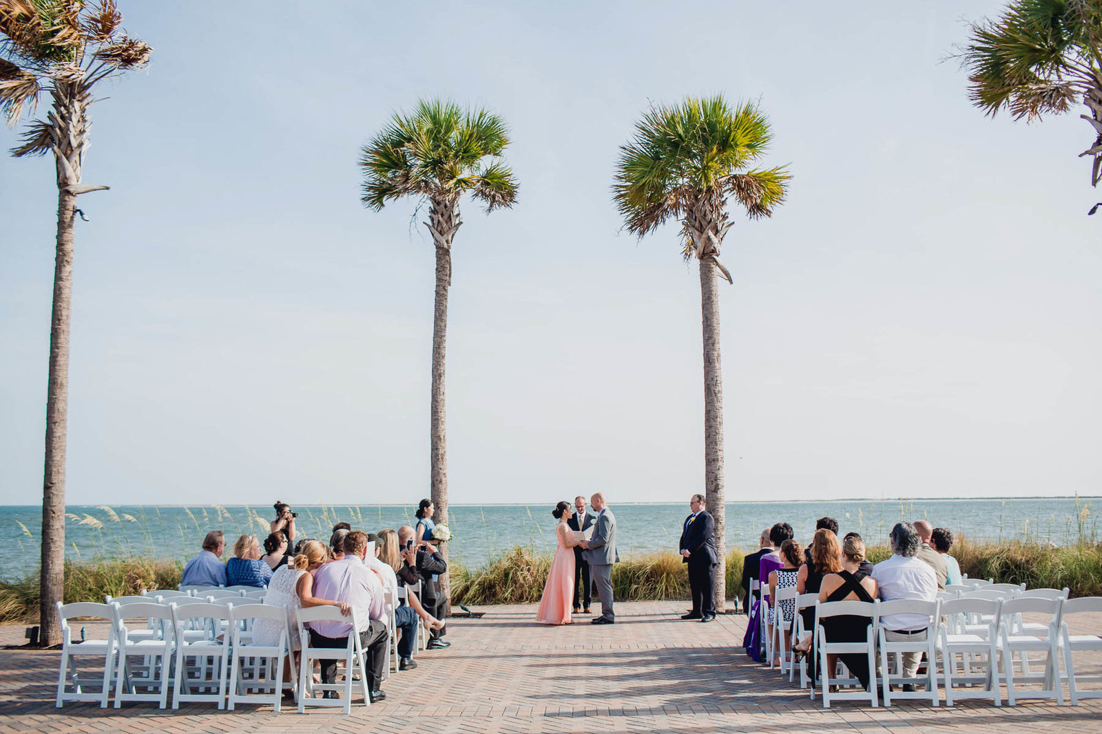 Ceremony is set up by palm trees, Seabrook Island Club, Charleston, South Carolina
